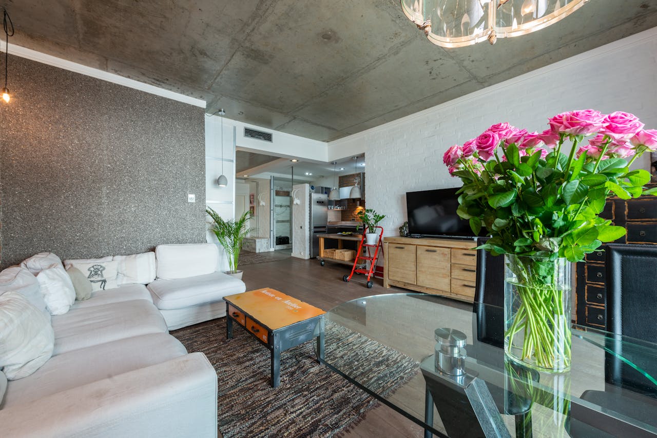 Bright and spacious modern living room with stylish decor and a cozy atmosphere.